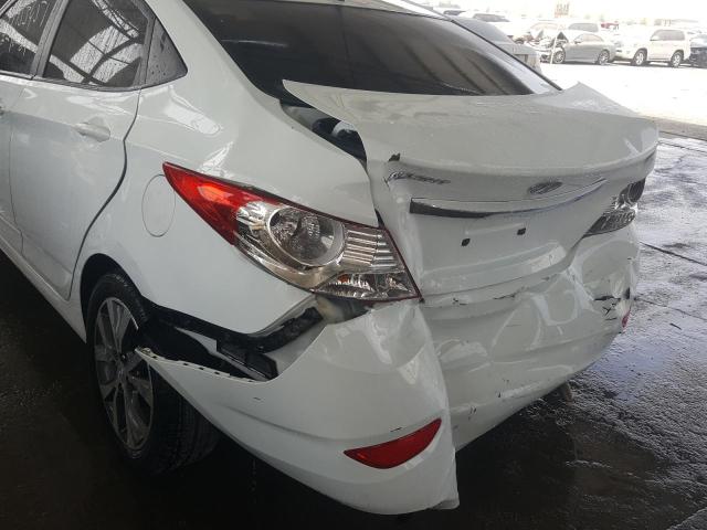 VIN: KMHCT41DBFU645511 Auction: COPART UAE Lot: 59953451 Location: DUBAI INDUSTRIAL CITY - DUBAI VIN: KMHCT41DBFU645511 HYUNDAI ACCENT 2015 WHITE Photo 9