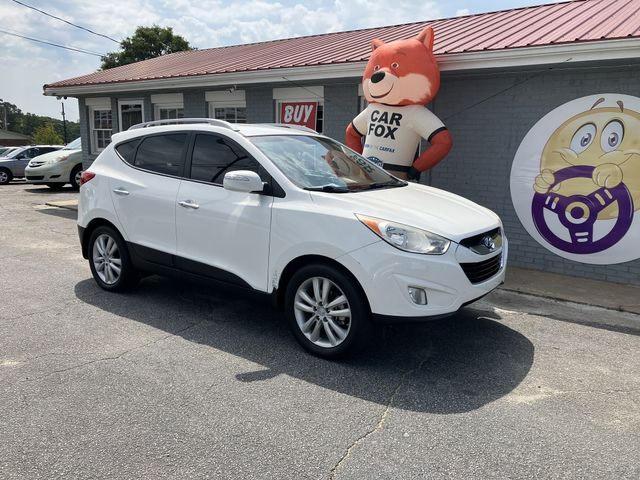 VIN: KM8JU3AC7DU692822 Auction: COPART Lot: 59233182 Location: GA - ATLANTA EAST KM8JU3AC7DU692822 HYUNDAI TUCSON 2013 WHITE Photo 1