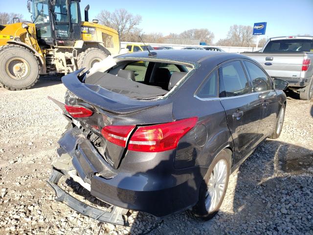 2015 FORD FOCUS TITA 1FADP3J25FL305683