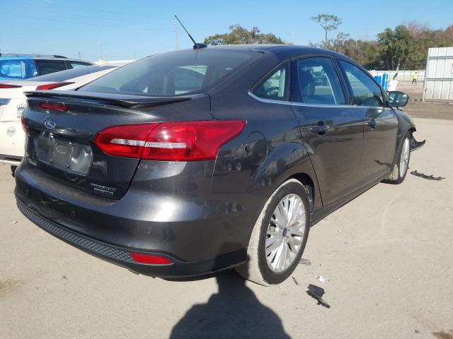 2016 FORD FOCUS TITA 1FADP3J23GL371845