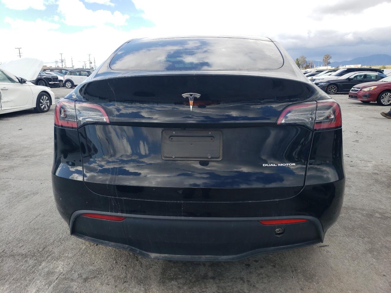 2023 Tesla Model Y VIN: 7SAYGDEE1PA057927 Lot: 86104204