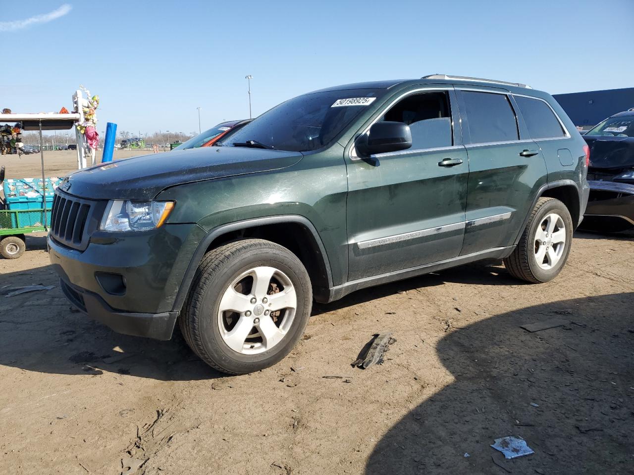 2011 Jeep Grand Cherokee Laredo zu verkaufen in Woodhaven, MI - Side