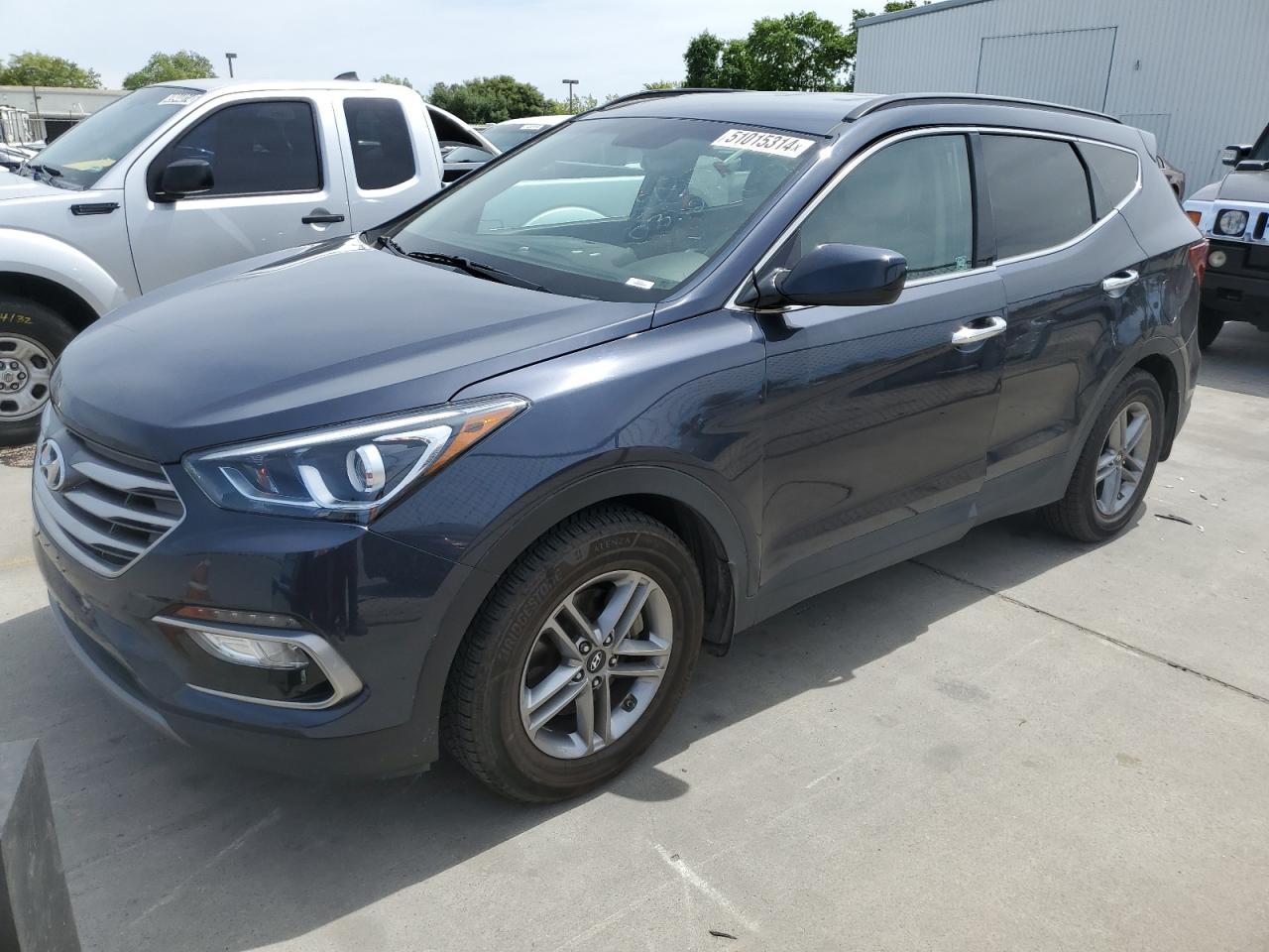 5NMZU3LB8HH009809 2017 HYUNDAI SANTA FE - Image 1