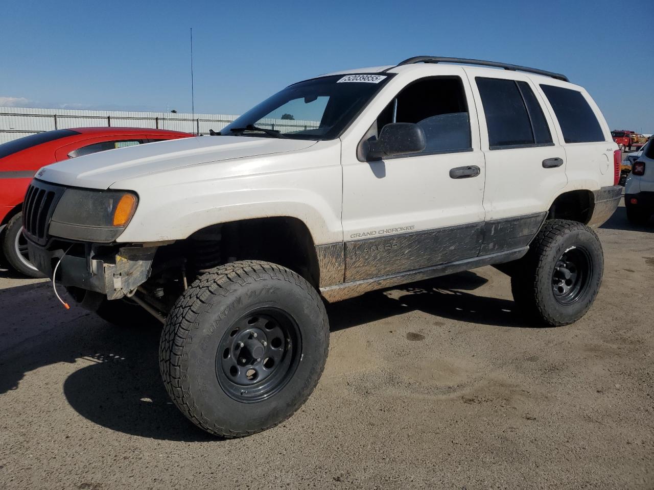 1999 Jeep Grand Cherokee Laredo zu verkaufen in Fresno, CA - Side