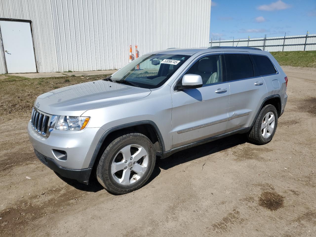 2011 Jeep Grand Cherokee Laredo zu verkaufen in Portland, MI - Side