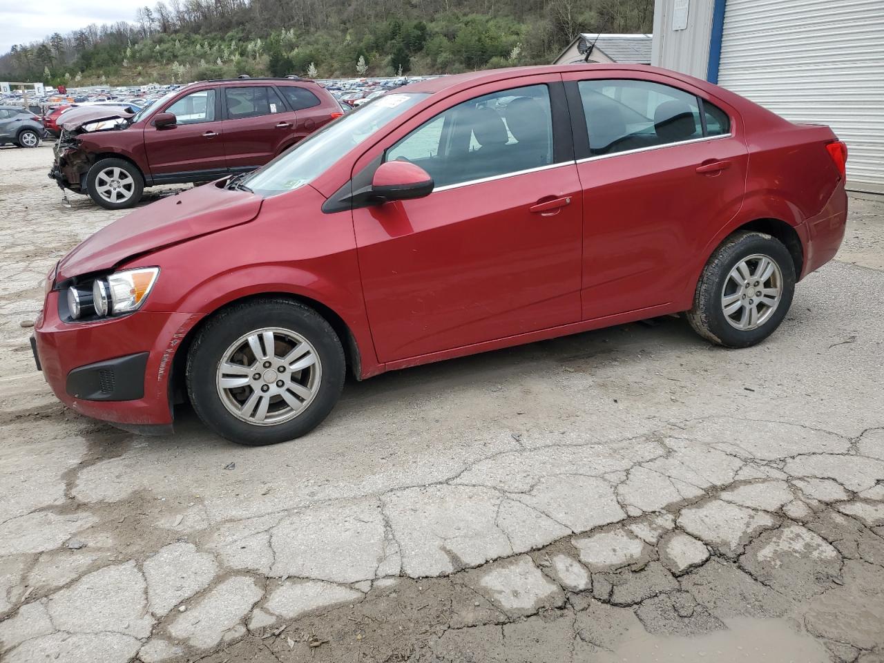 2013 Chevrolet Sonic Lt იყიდება Hurricane-ში, WV - All Over