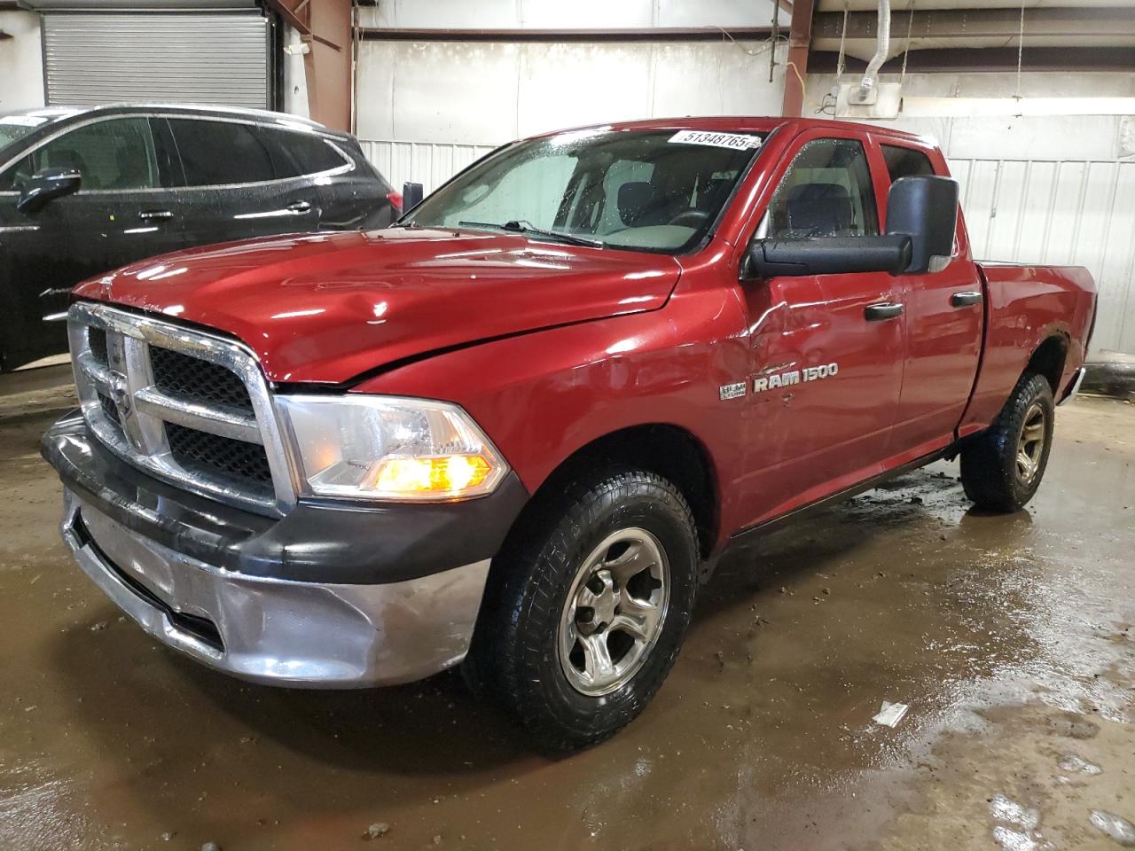 2011 Dodge Ram 1500 продається в Lansing, MI - Rollover