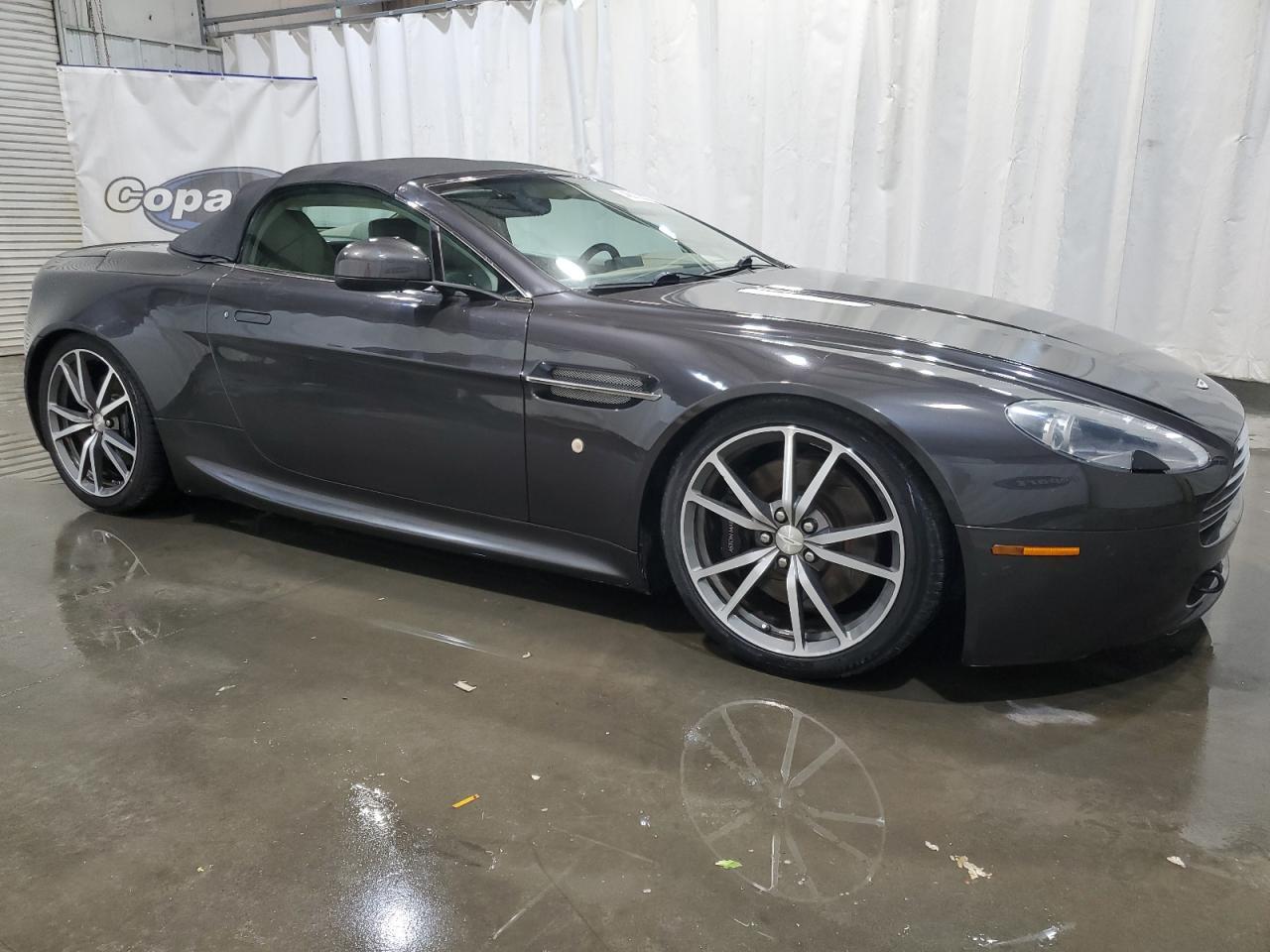 SCFEFBBCXAGD13755 Auction: COPART Lot: 52372665 Location: MO - SPRINGFIELD SCFEFBBCXAGD13755 ASTON MARTIN ALL MODELS 2010 GRAY Photo 4