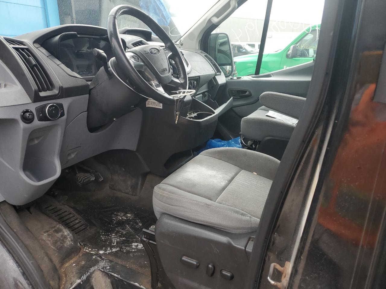 2015 Ford Transit T-150 VIN: 1FTYE1YM8FKB06145 Lot: 65297805