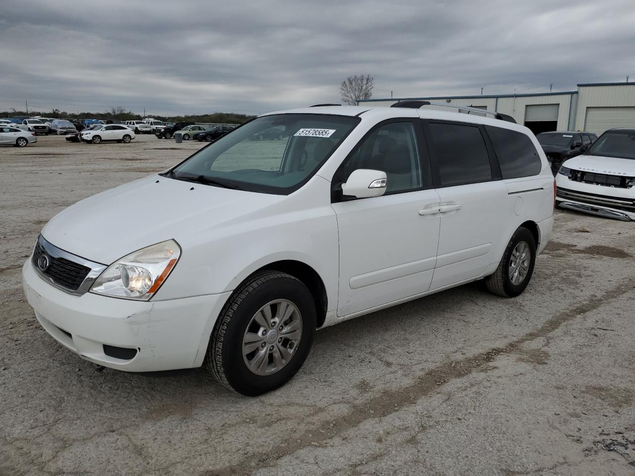 2012 Kia Sedona Lx للبيع في Kansas City، KS - Side
