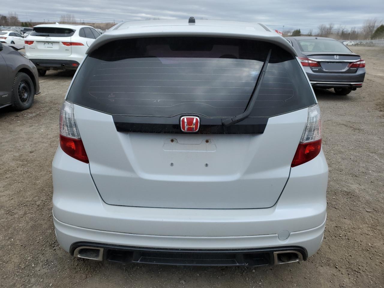 2009 Honda Fit Lx VIN: JHMGE87579S803694 Lot: 52589325