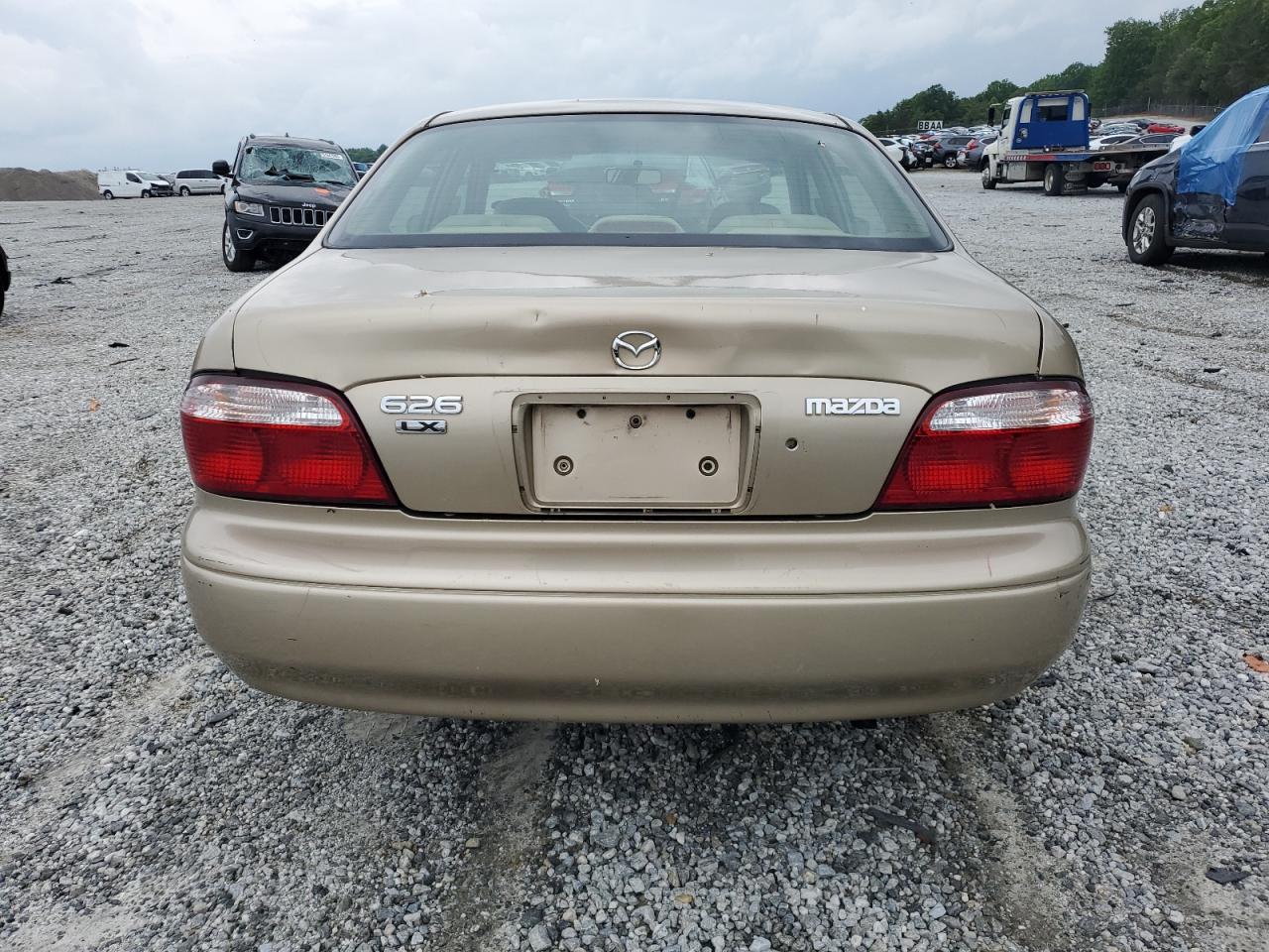 2001 Mazda 626 Es VIN: 1YVGF22C715202574 Lot: 54132915