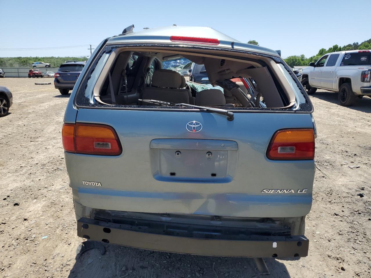 1999 Toyota Sienna Le VIN: 4T3ZF13C7XU136407 Lot: 64279465