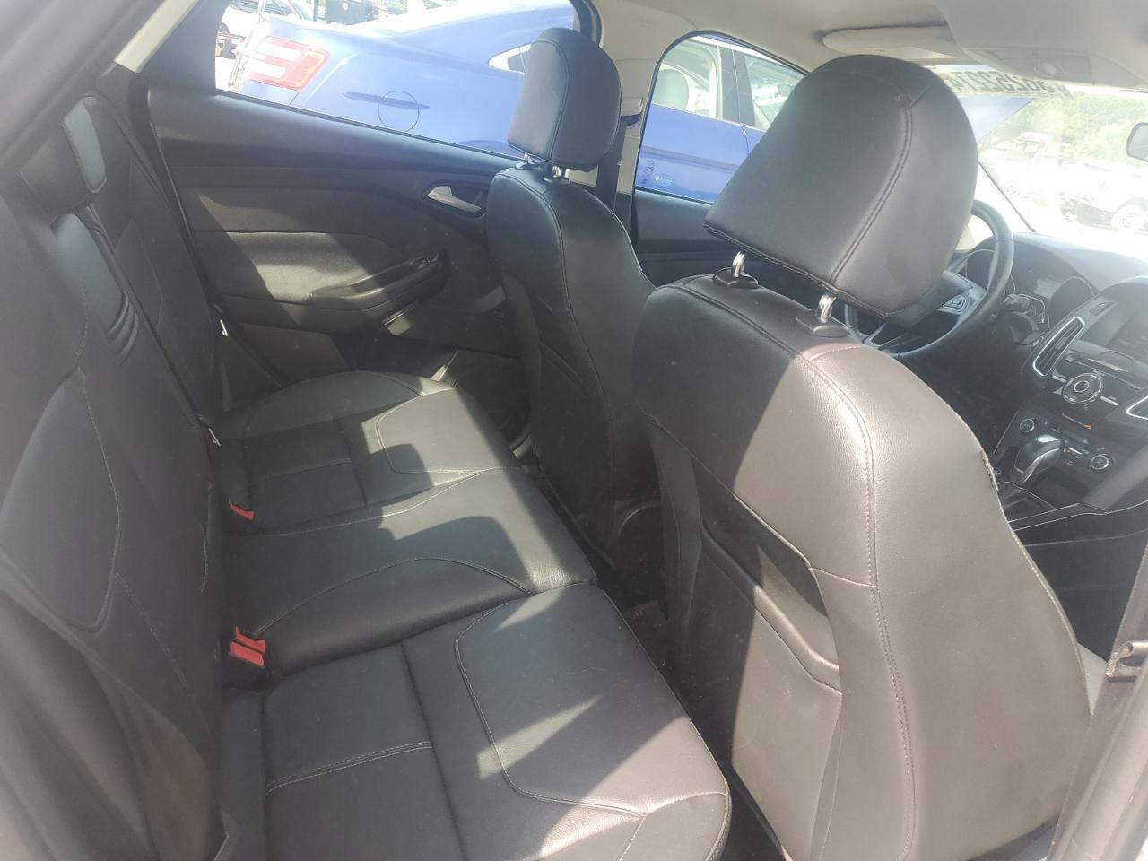 2015 Ford Focus Titanium VIN: 1FADP3J22FL323879 Lot: 56252274