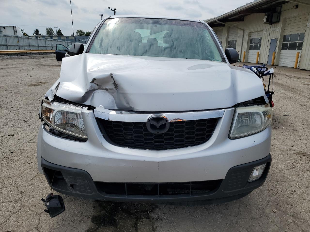 2010 Mazda Tribute I VIN: 4F2CY0C74AKM05590 Lot: 55279104