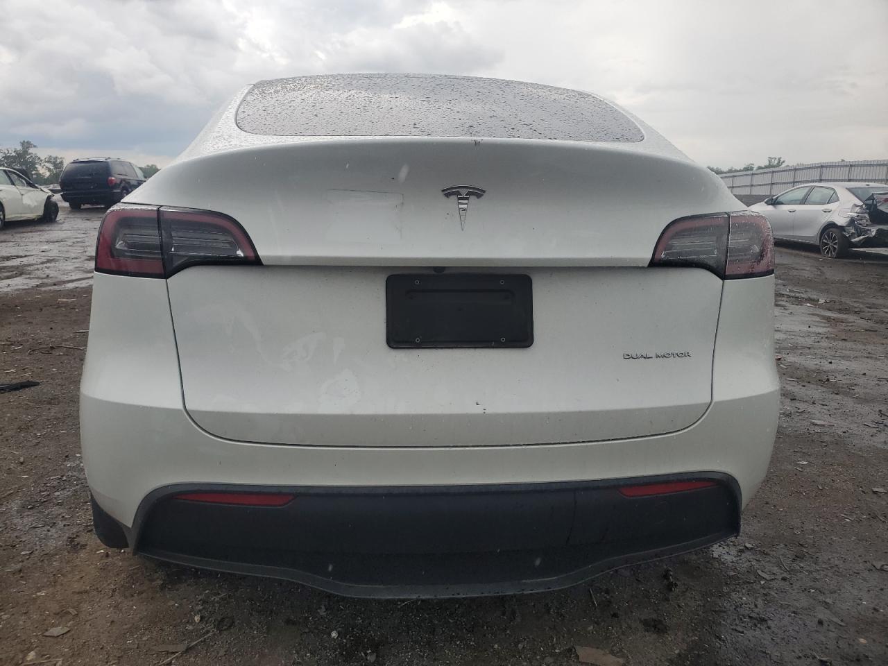 2023 Tesla Model Y VIN: 7SAYGDEE7PF661825 Lot: 57185965
