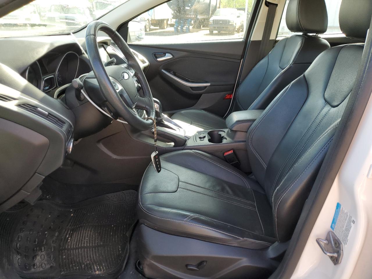 2014 Ford Focus Titanium VIN: 1FADP3J20EL199447 Lot: 54268465