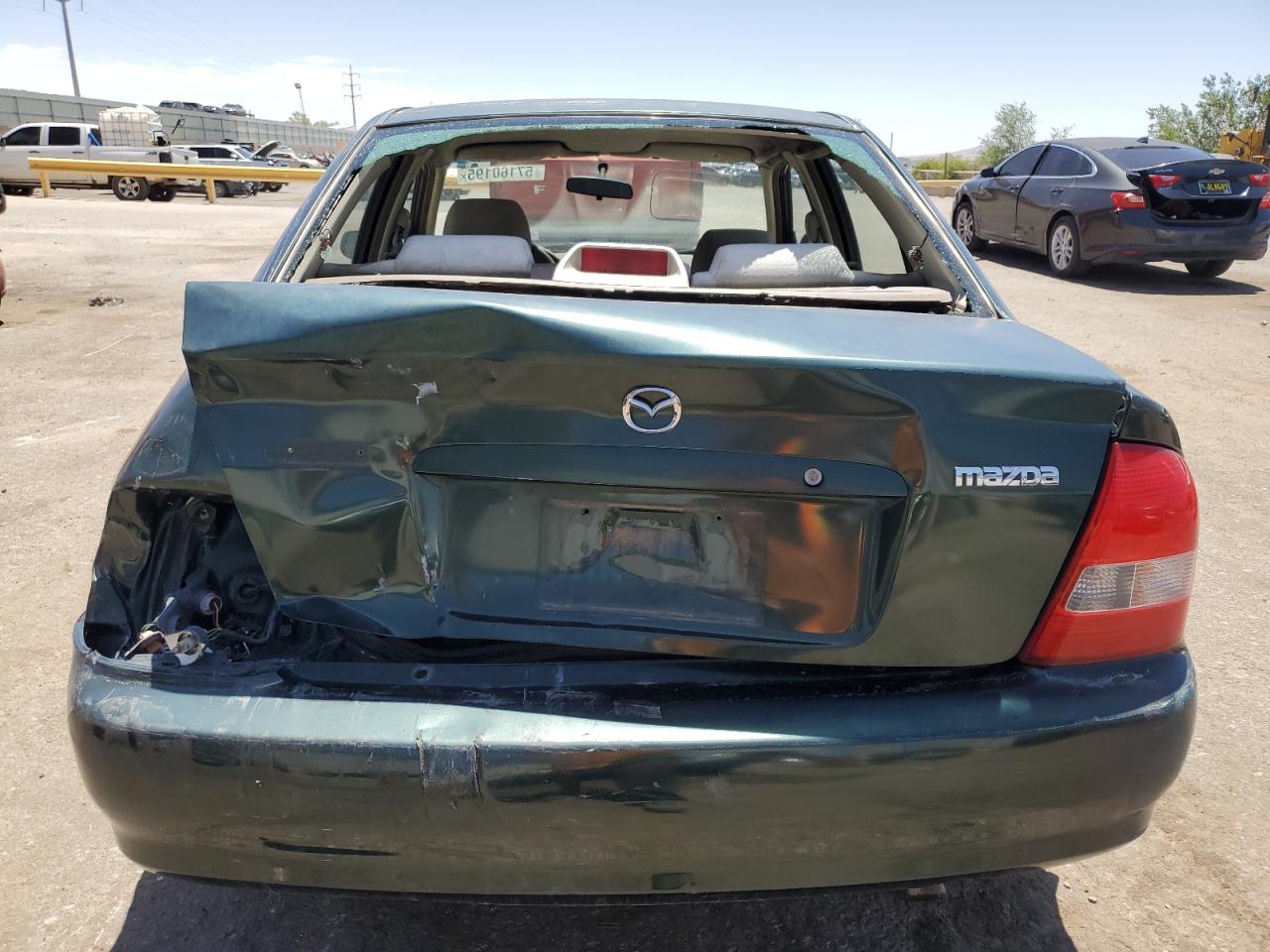 2000 Mazda Protege Dx VIN: JM1BJ222XY0275662 Lot: 57160195