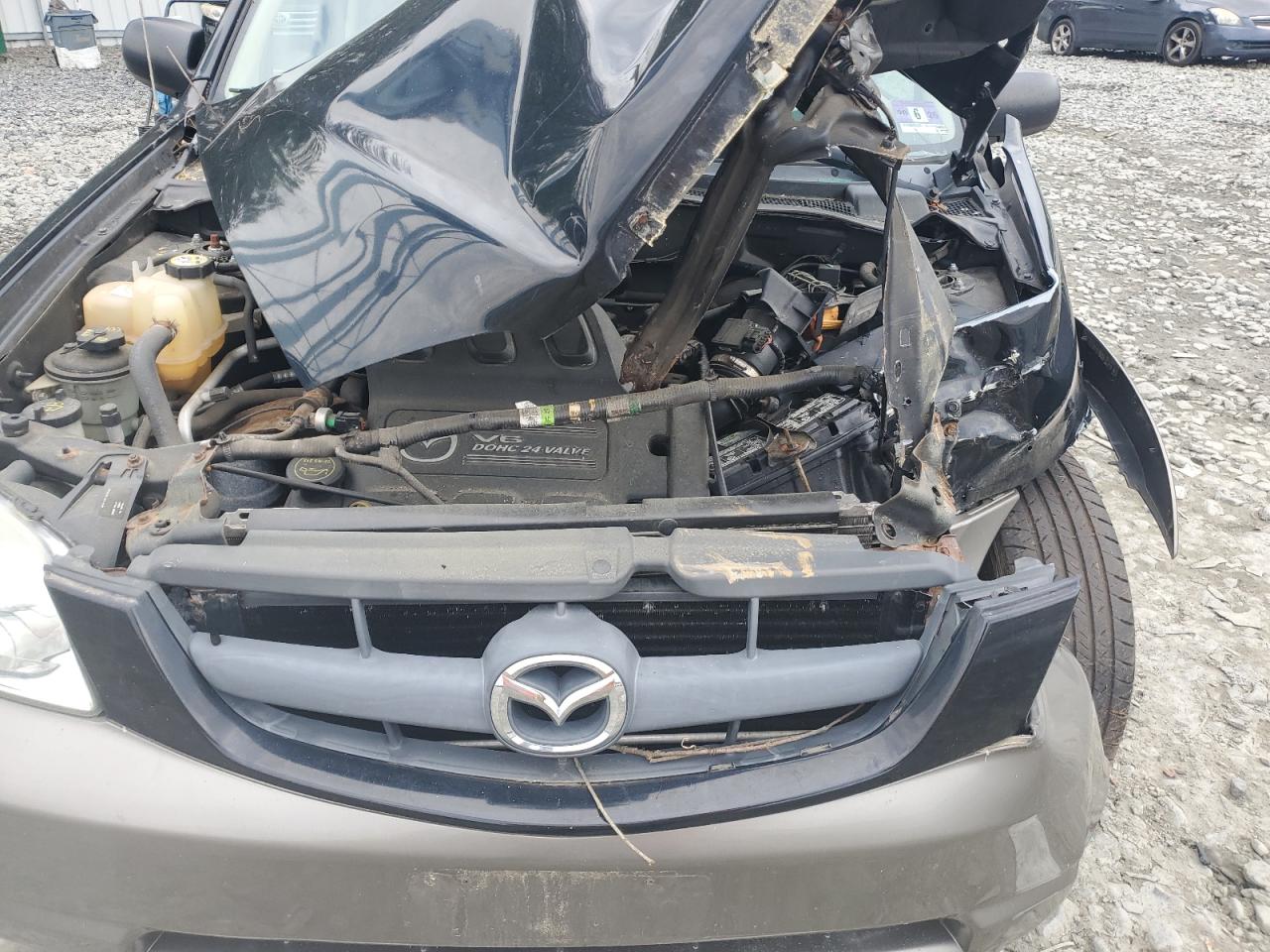 2003 Mazda Tribute Lx VIN: 4F2CZ94123KM49876 Lot: 58273045