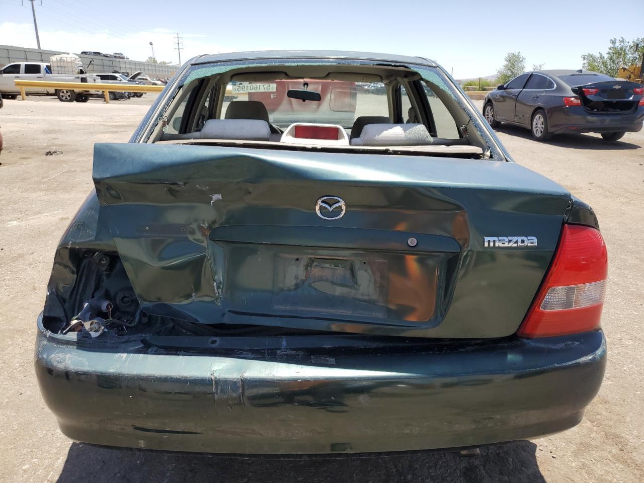 2000 Mazda Protege Dx VIN: JM1BJ222XY0275662 Lot: 57160195