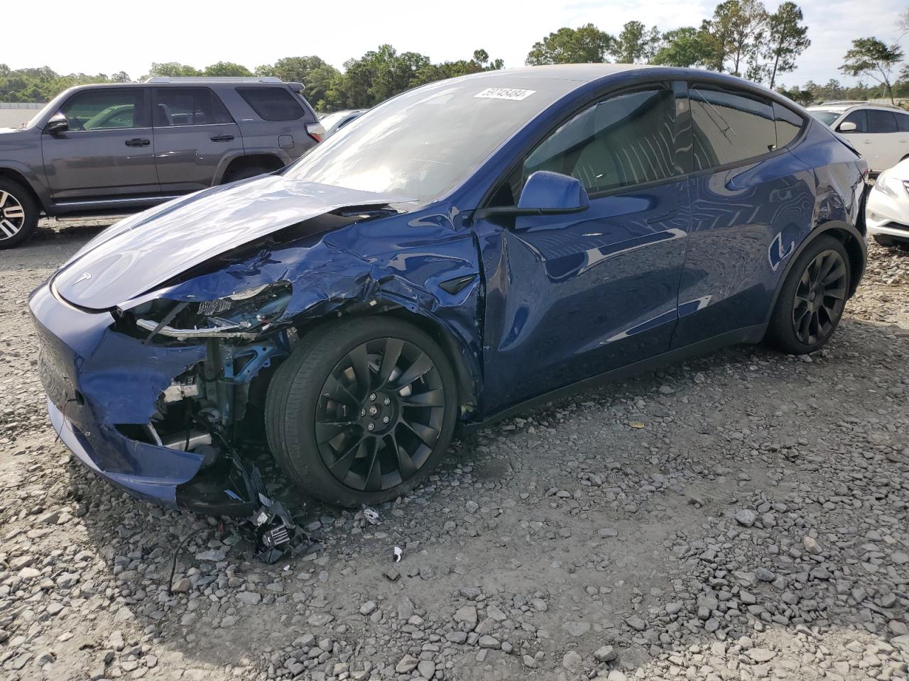 2023 Tesla Model Y VIN: 7SAYGDEE1PA140399 Lot: 59745484