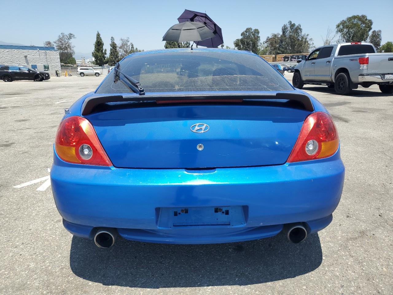 2004 Hyundai Tiburon VIN: KMHHM65DX4U136457 Lot: 58917914