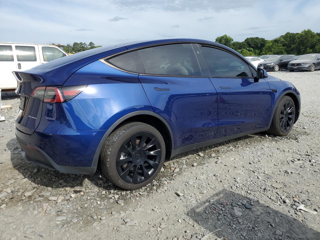 2023 Tesla Model Y VIN: 7SAYGDEE1PA140399 Lot: 59745484