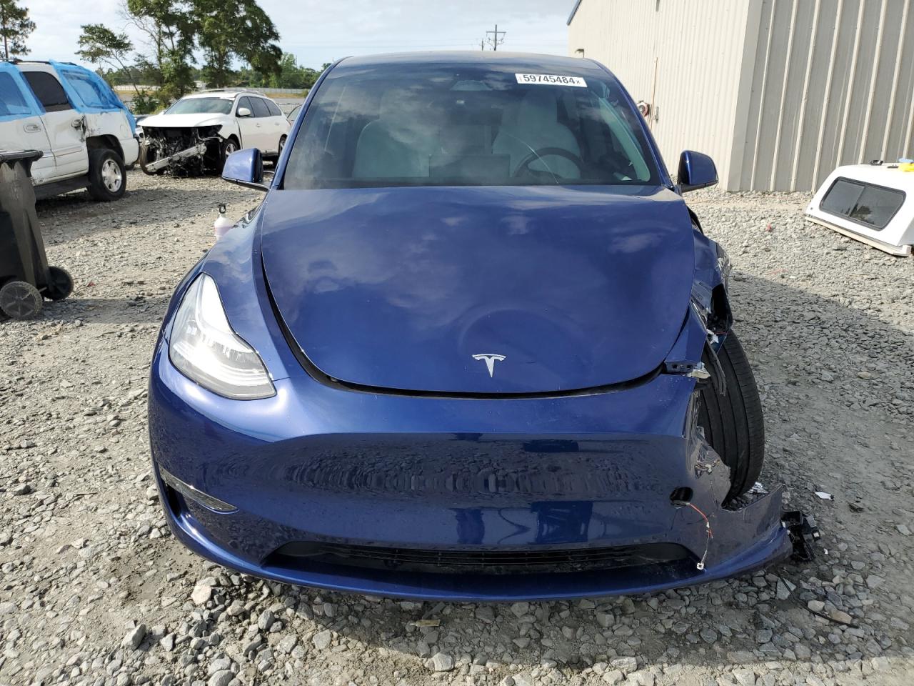 2023 Tesla Model Y VIN: 7SAYGDEE1PA140399 Lot: 59745484