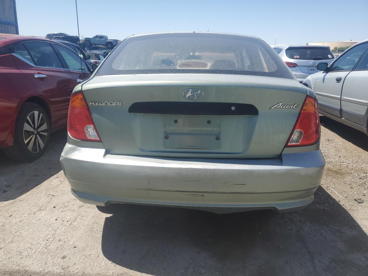 2004 Hyundai Accent L VIN: KMHCF35C74U318143 Lot: 59444534