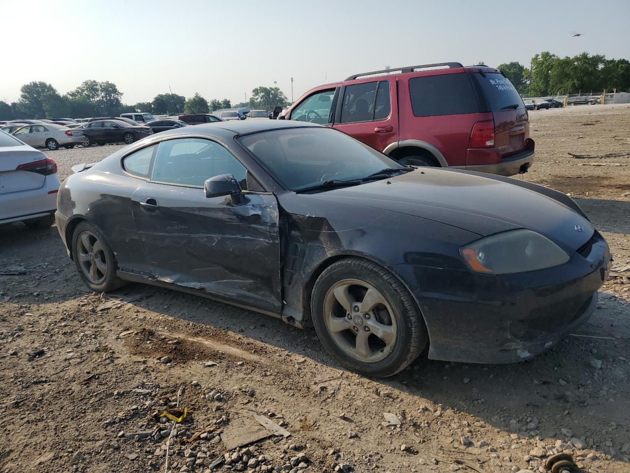 2005 Hyundai Tiburon VIN: KMHHM65D95U187465 Lot: 59063404