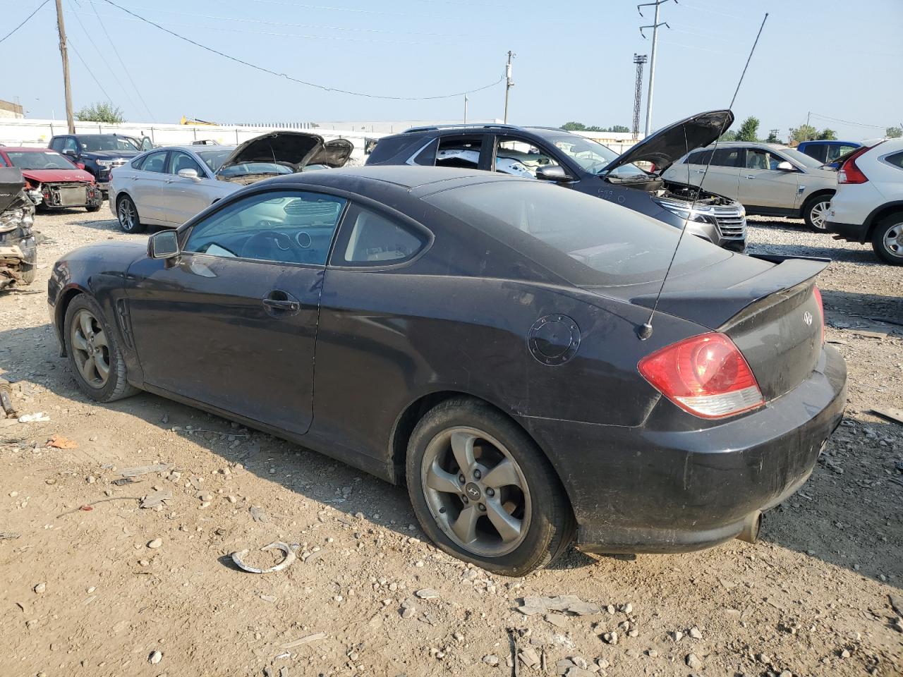 2005 Hyundai Tiburon VIN: KMHHM65D95U187465 Lot: 59063404