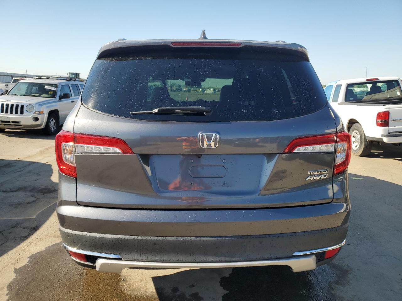 2021 Honda Pilot Touring VIN: 5FNYF6H90MB060391 Lot: 59552054