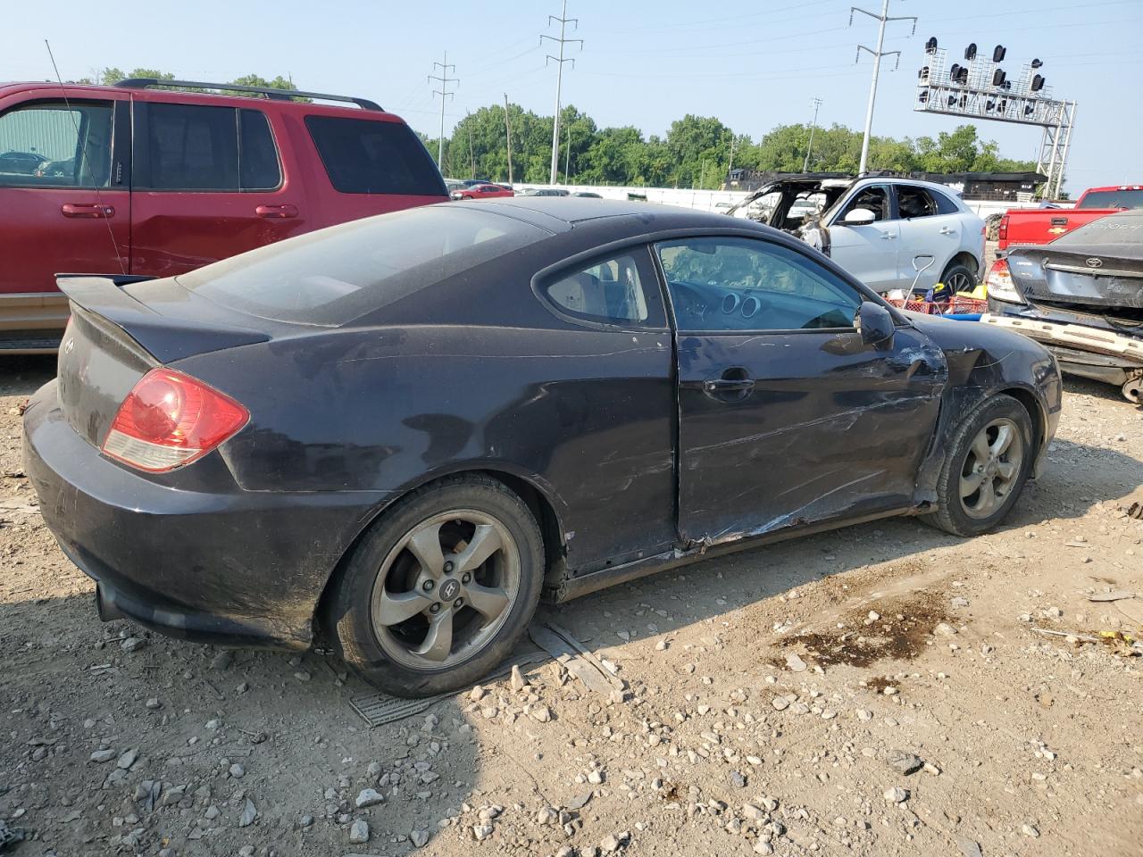 2005 Hyundai Tiburon VIN: KMHHM65D95U187465 Lot: 59063404
