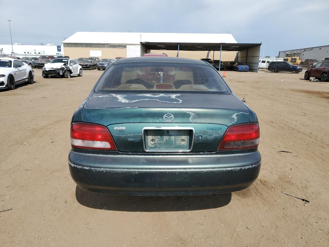 1999 Mazda 626 Es VIN: 1YVGF22C0X5835555 Lot: 57281104