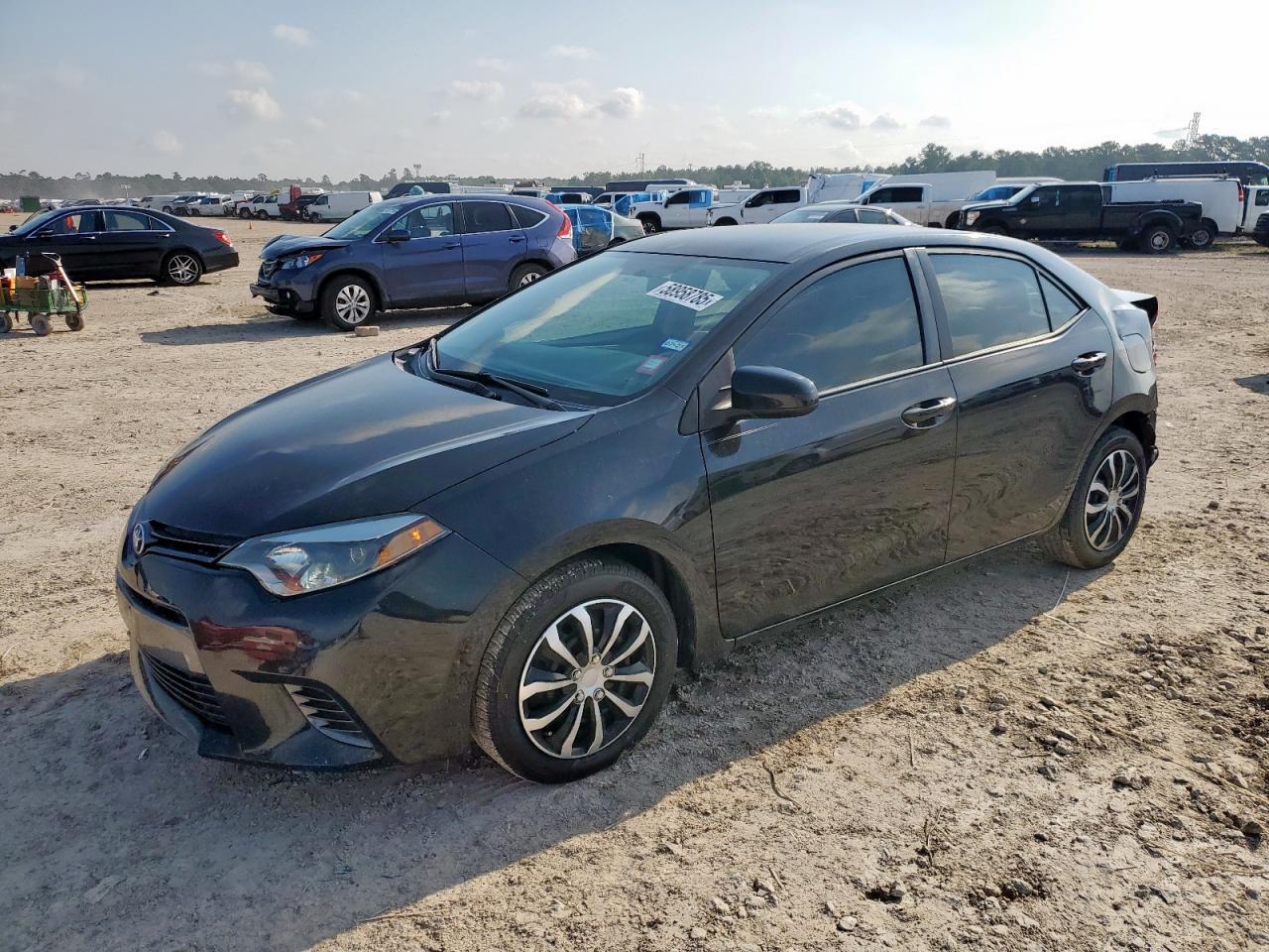 2015 Toyota Corolla L black sedan gas 5YFBURHE3FP353283 photo #1