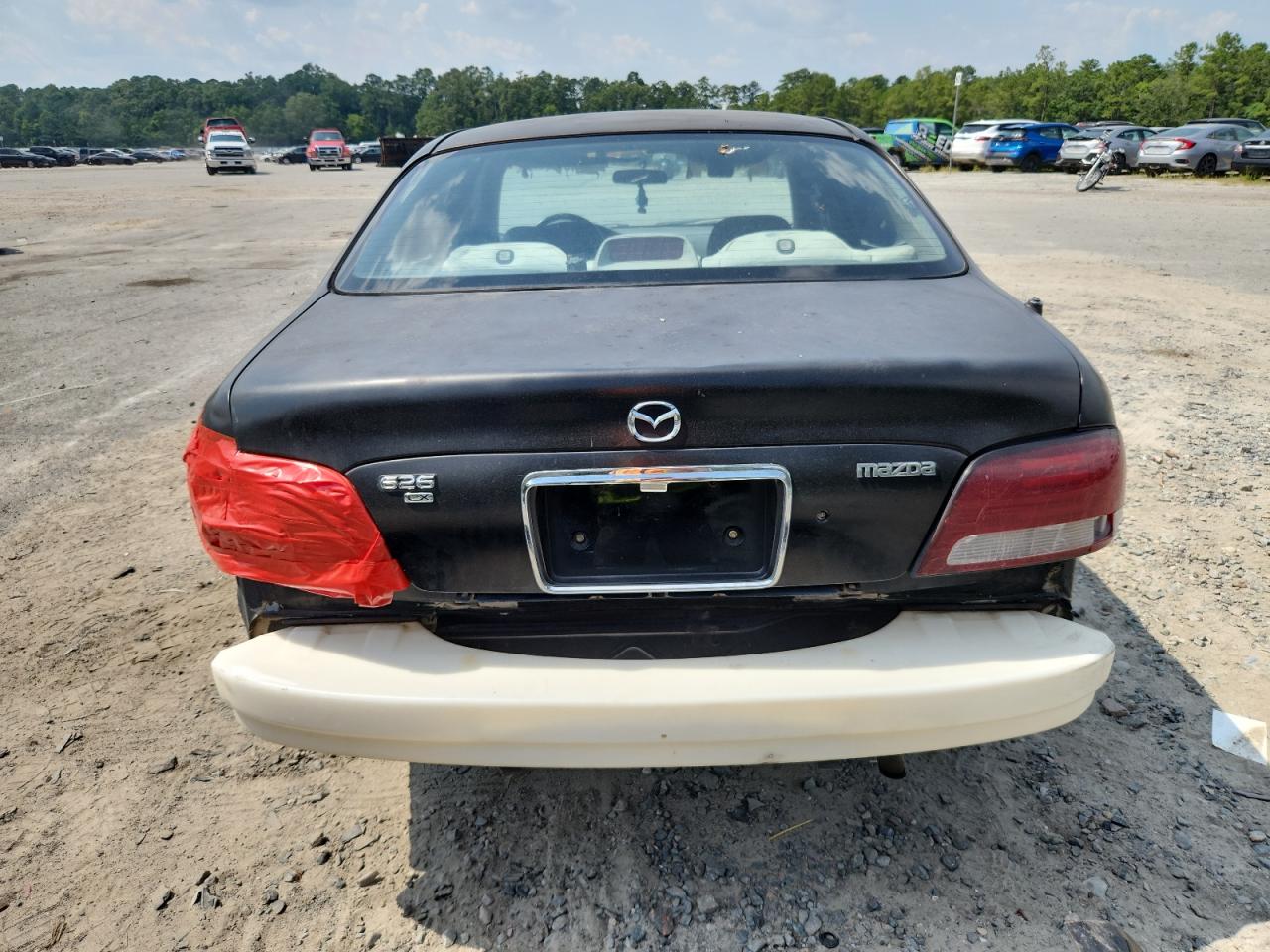 1999 Mazda 626 Es VIN: 1YVGF22C4X5820864 Lot: 59305085