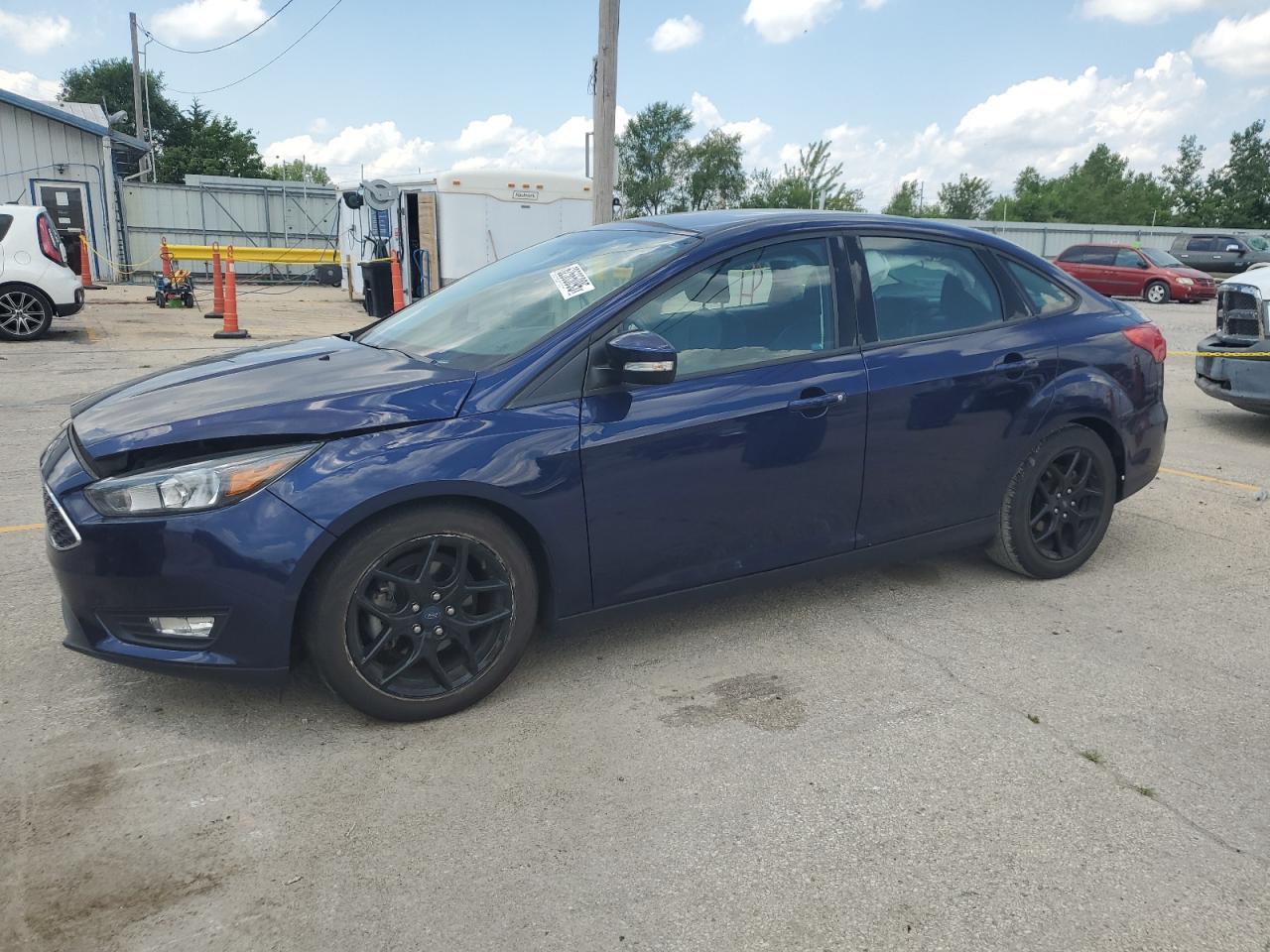 FORD FOCUS 2016 VIN 1FADP3F23GL288232
