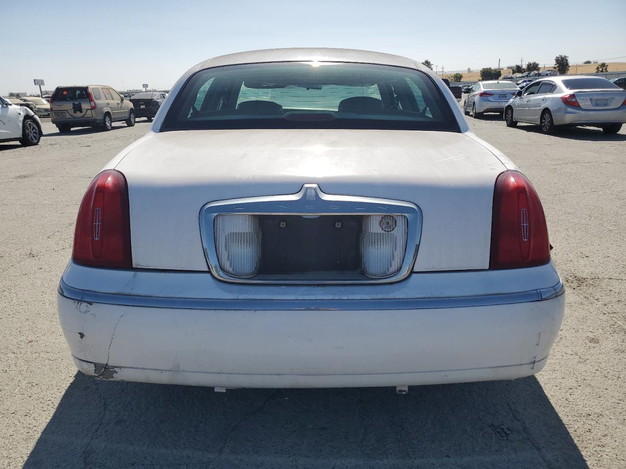1999 Lincoln Town Car Executive VIN: 1LNHM81WXXY694812 Lot: 61448815
