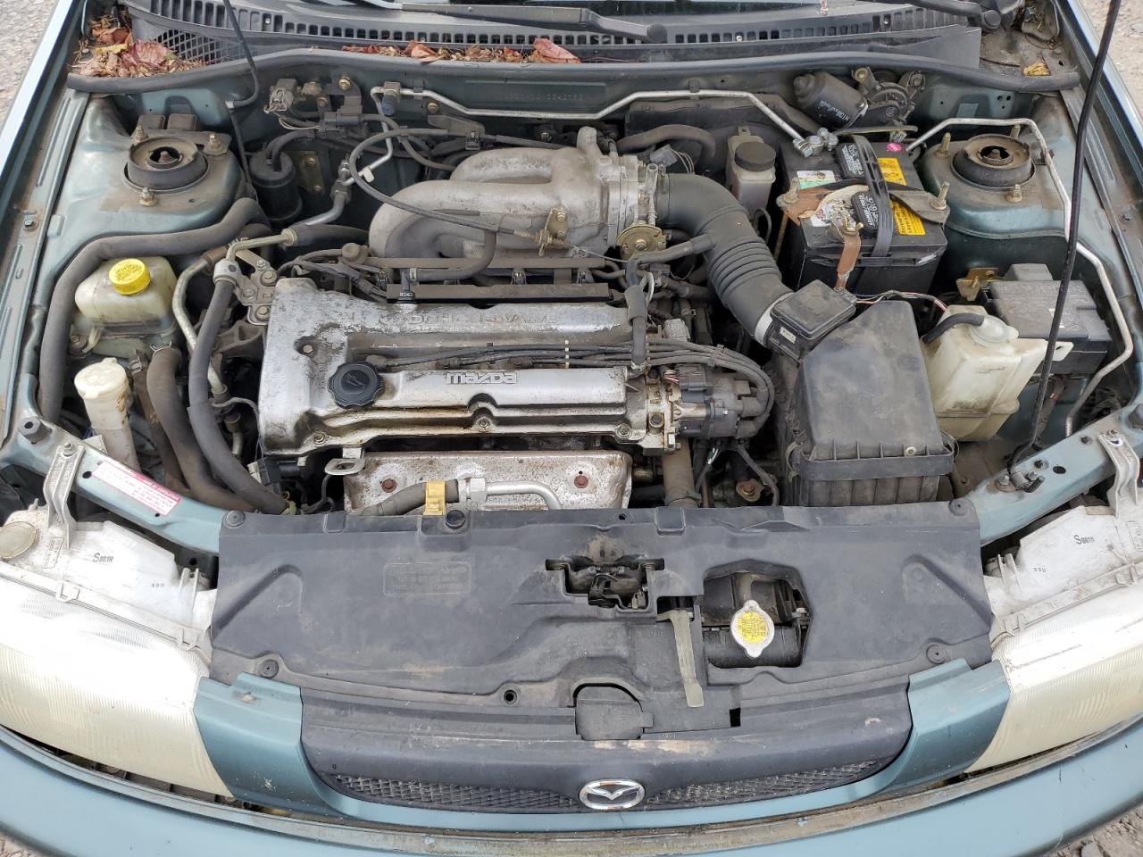 1998 Mazda Protege Dx VIN: JM1BC1410W0242160 Lot: 62419175