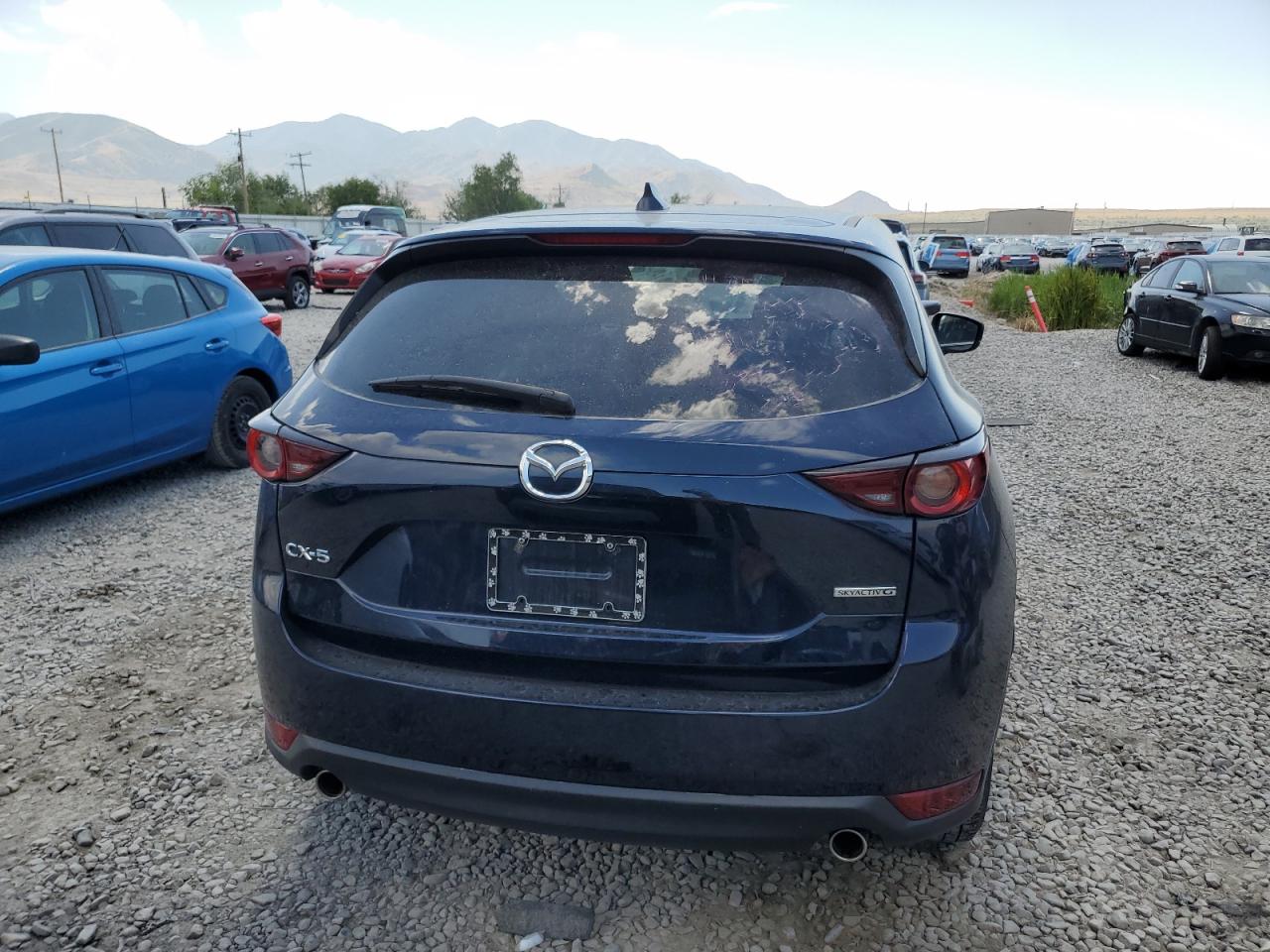 2021 Mazda Cx-5 Touring VIN: JM3KFACMXM0445550 Lot: 60266535