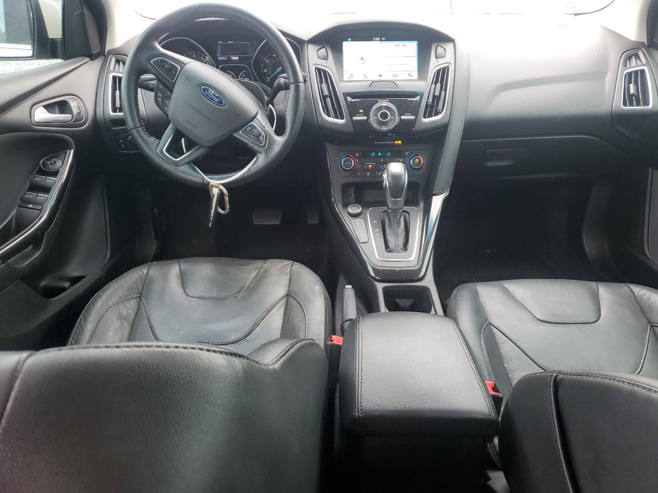 2016 Ford Focus Titanium VIN: 1FADP3N22GL292399 Lot: 63033385