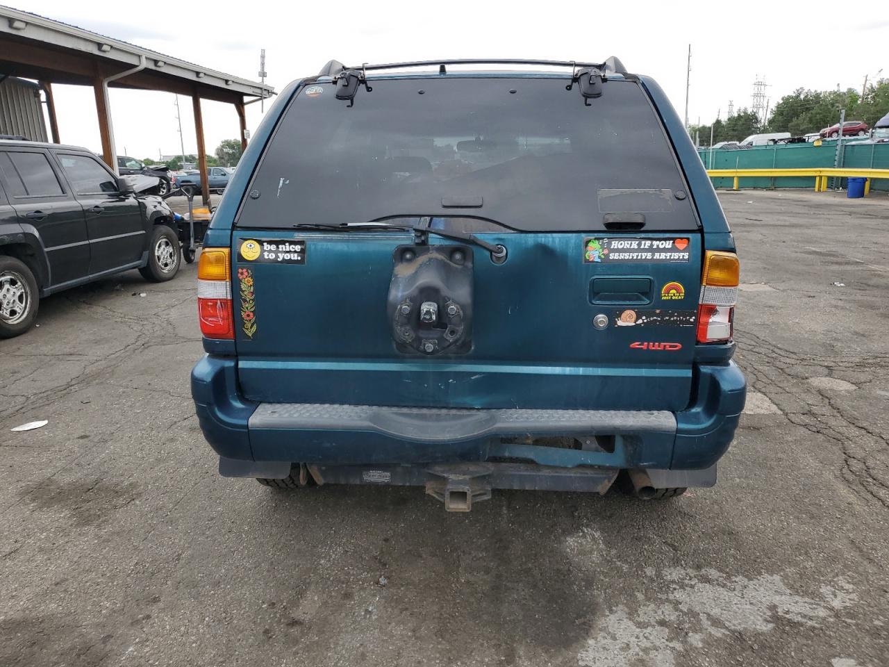 1999 Isuzu Rodeo S VIN: 4S2CM58W5X4313060 Lot: 62211235