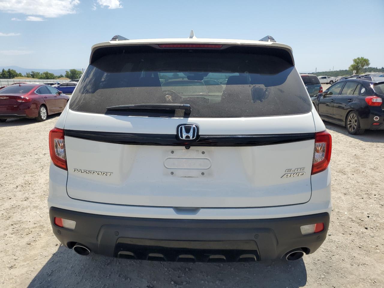 2021 Honda Passport Elite VIN: 5FNYF8H03MB007617 Lot: 63036345