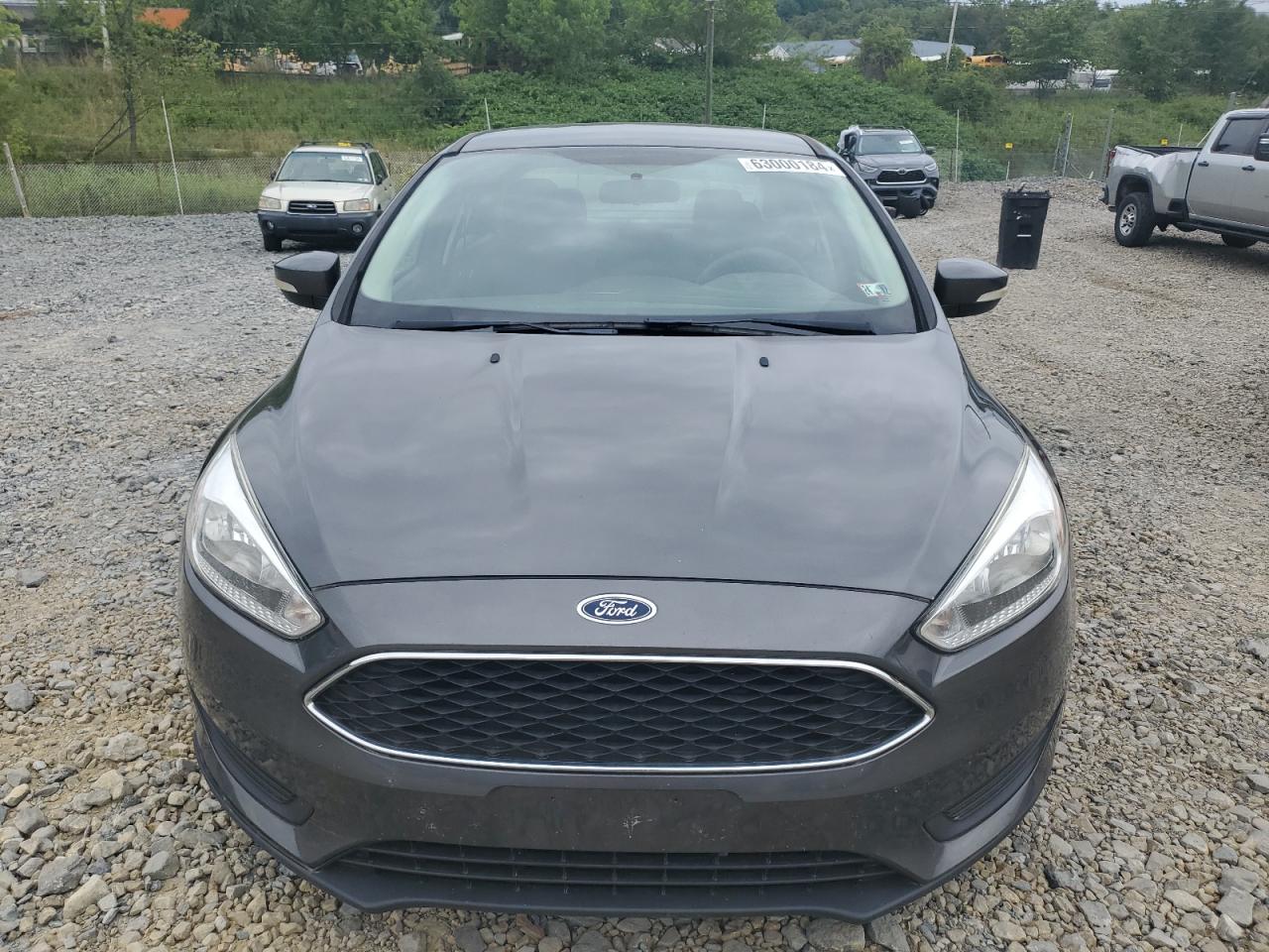 2016 Ford Focus Se VIN: 1FADP3F24GL377789 Lot: 63000184