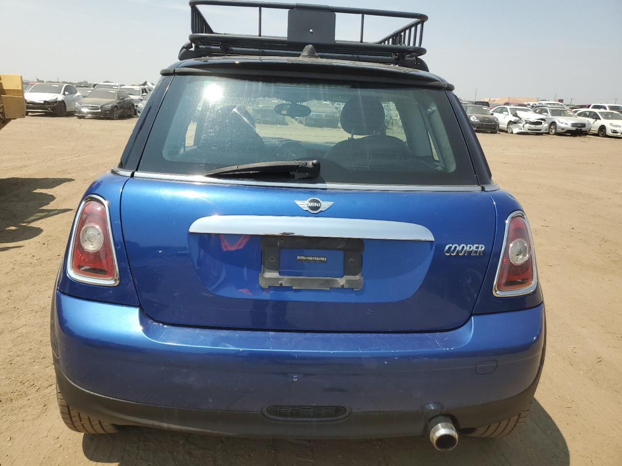 2009 Mini Cooper VIN: WMWMF33529TU72010 Lot: 64856864