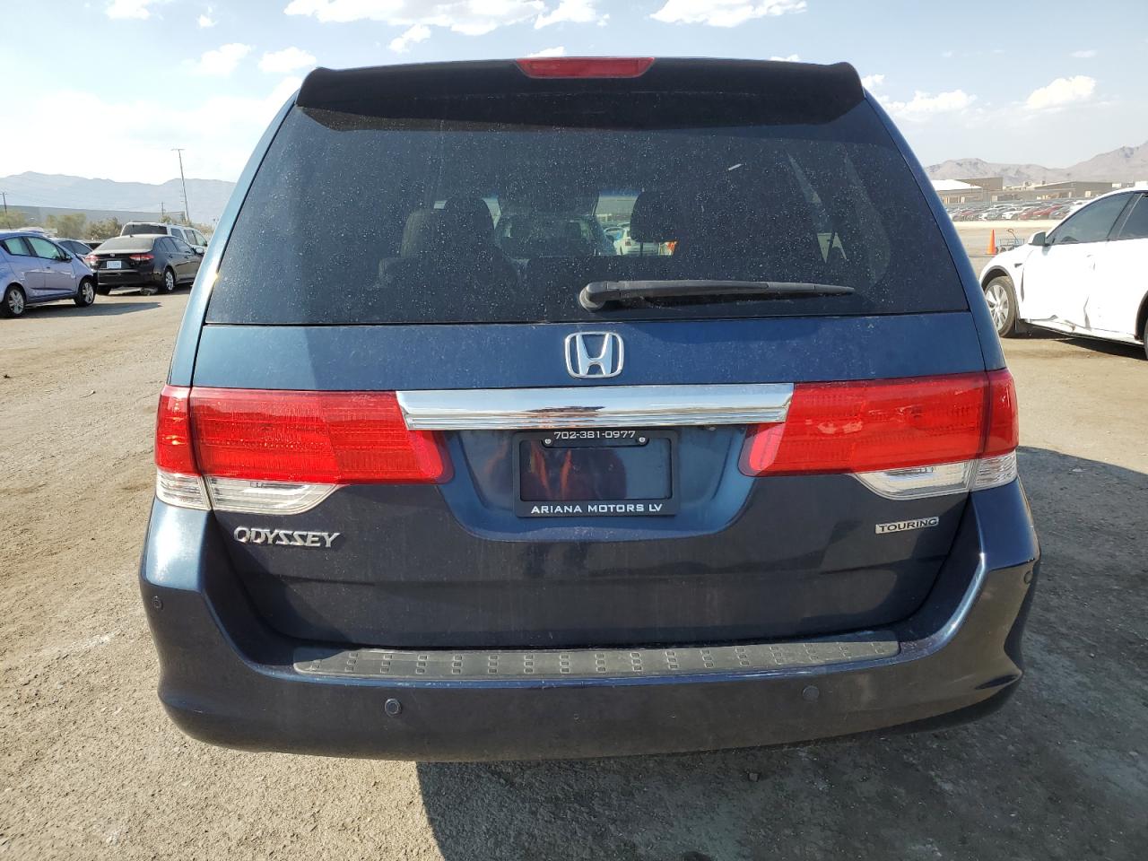 2010 Honda Odyssey Touring VIN: 5FNRL3H90AB001879 Lot: 64860244
