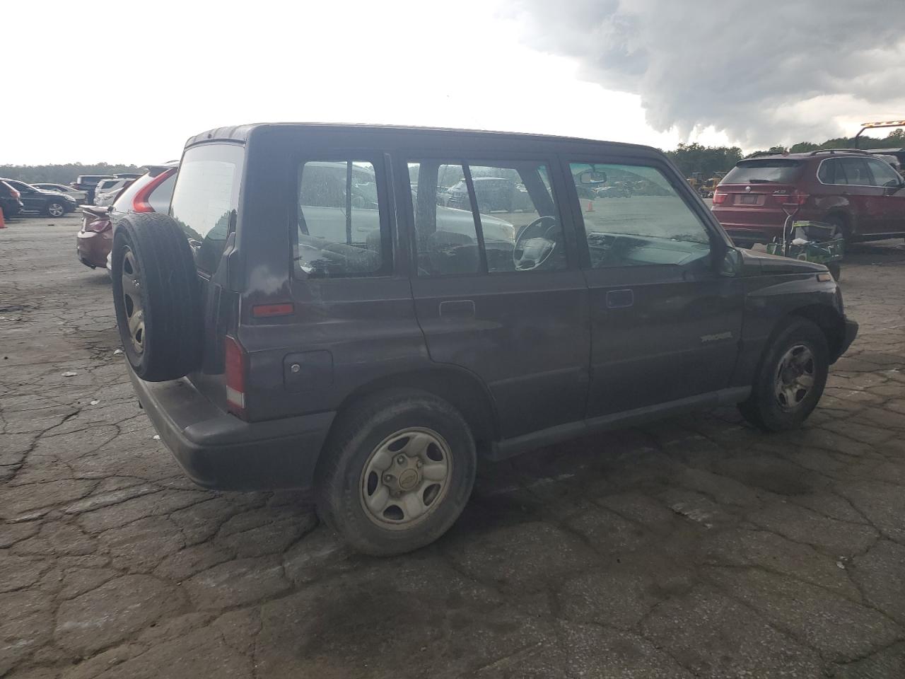 1998 Chevrolet Tracker VIN: 2CNBE1367W6919926 Lot: 63824914