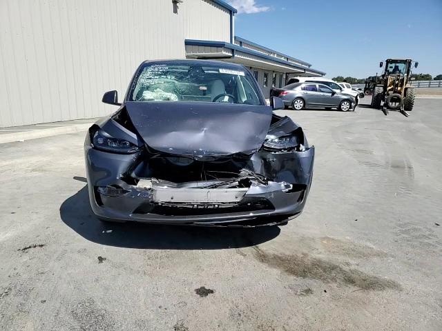 2023 Tesla Model Y VIN: 7SAYGDEE9PF883928 Lot: 63696134