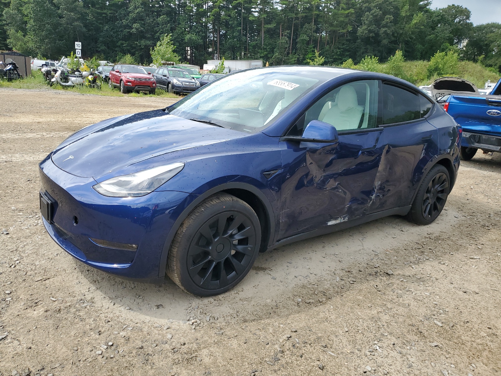 2023 Tesla Model Y vin: 7SAYGAEE5PF695051