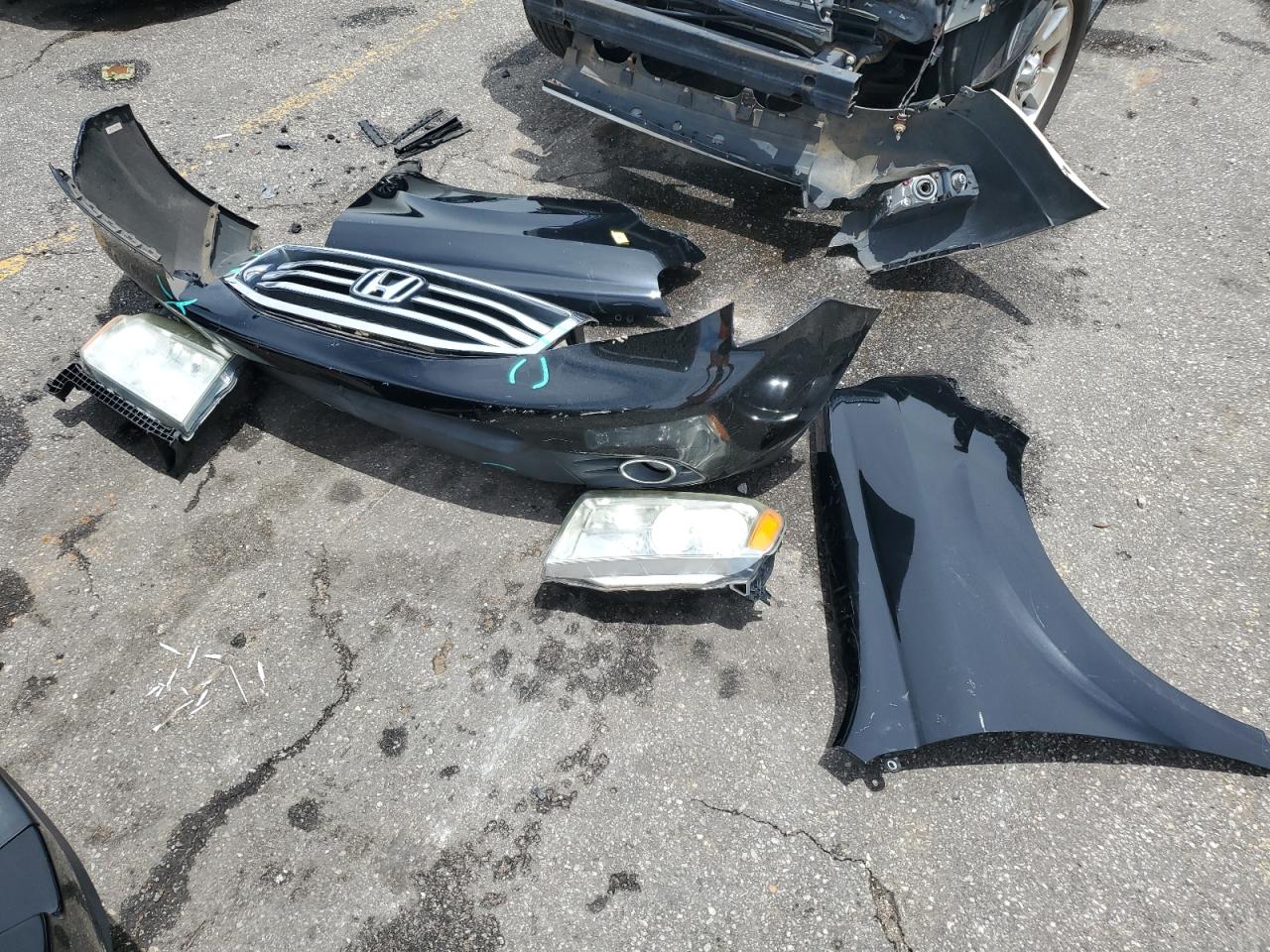 2012 Honda Pilot Exln VIN: 5FNYF4H77CB033383 Lot: 63778054